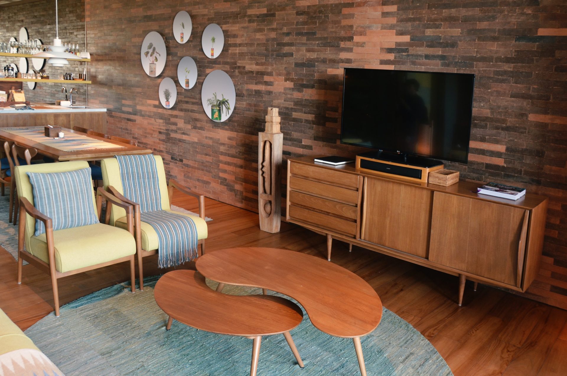 Mid-century Boho living room with wood credenza and unique coffee table