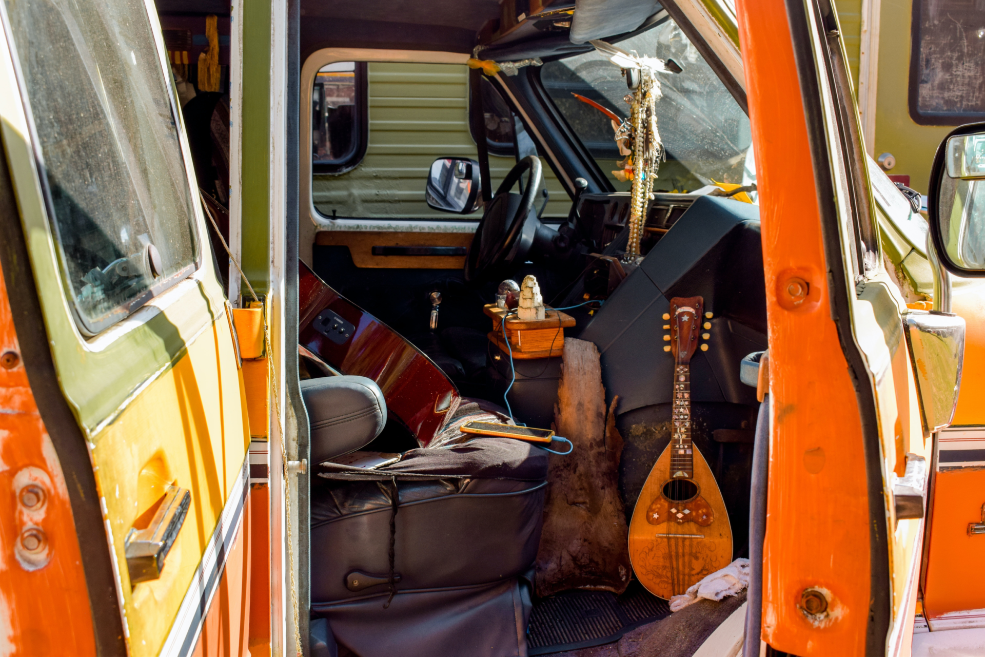 A bright orange travel van with Bohemian styling interior