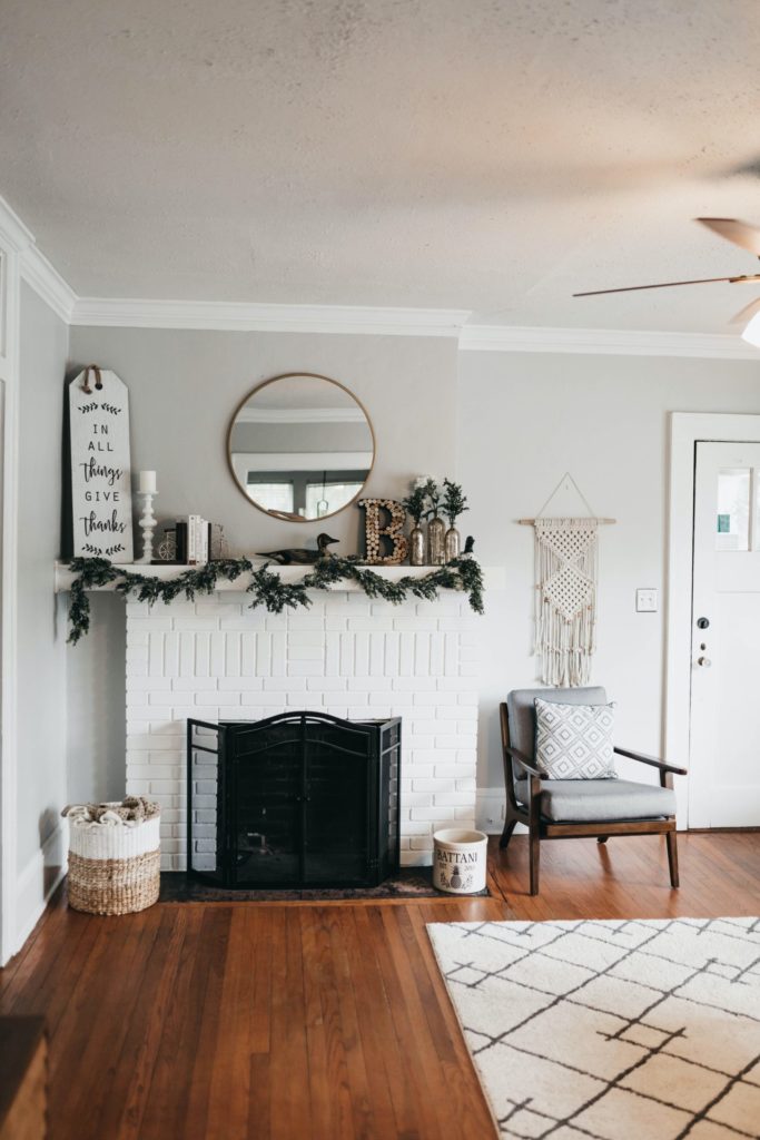 Boho room with garland on fireplace mantle