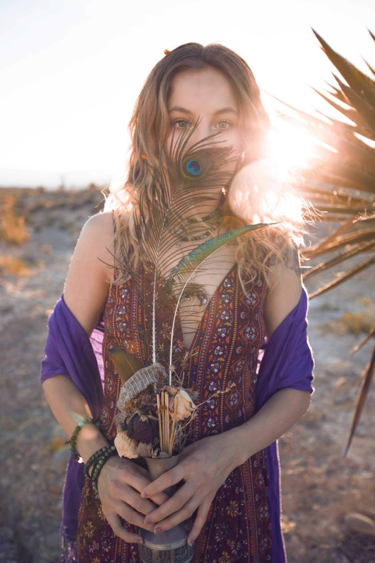 A woman wearing a boho look with a chic style and vintage clothing