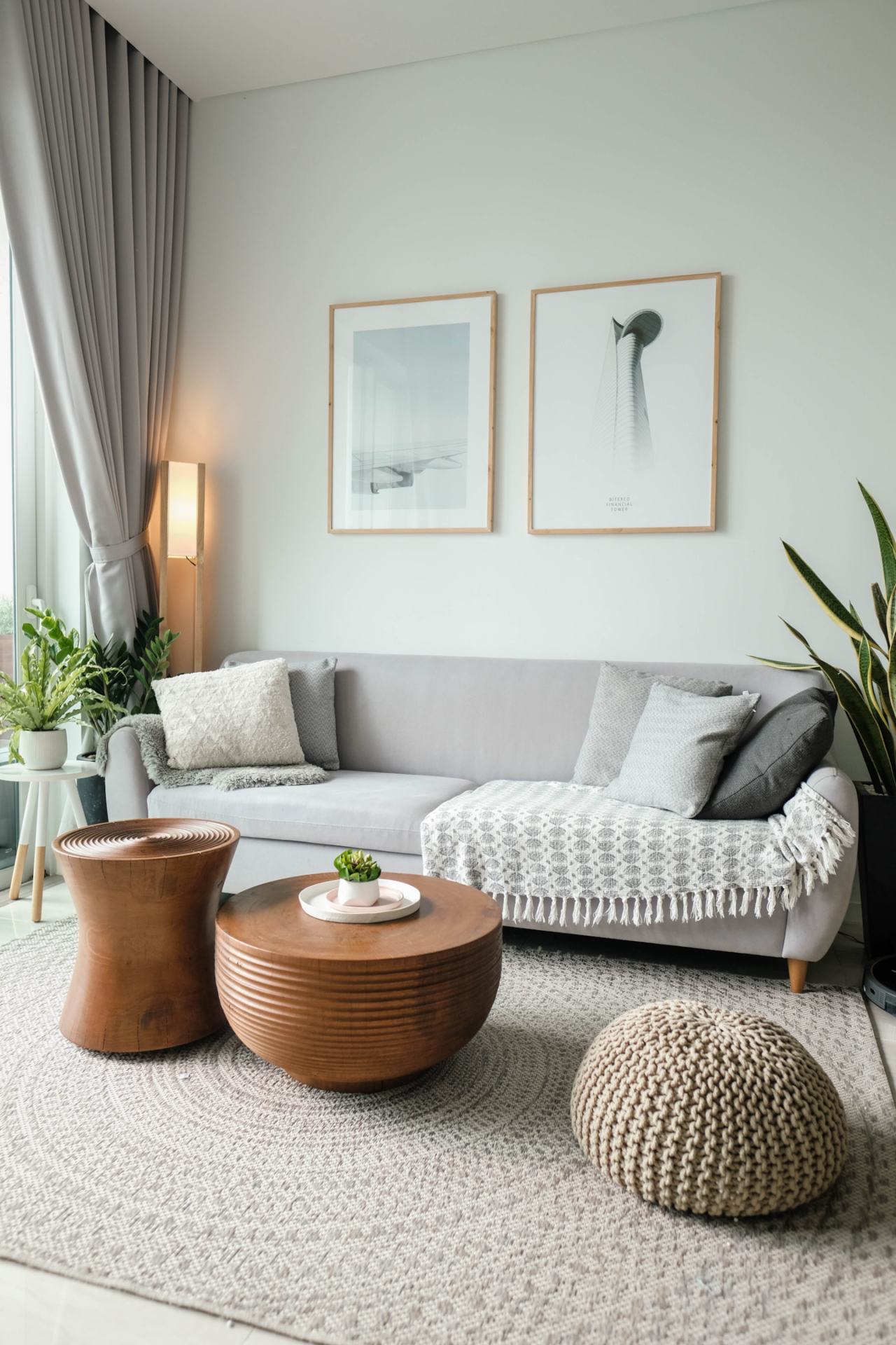 A boho style living room with personal touches and different textures and neutral tones