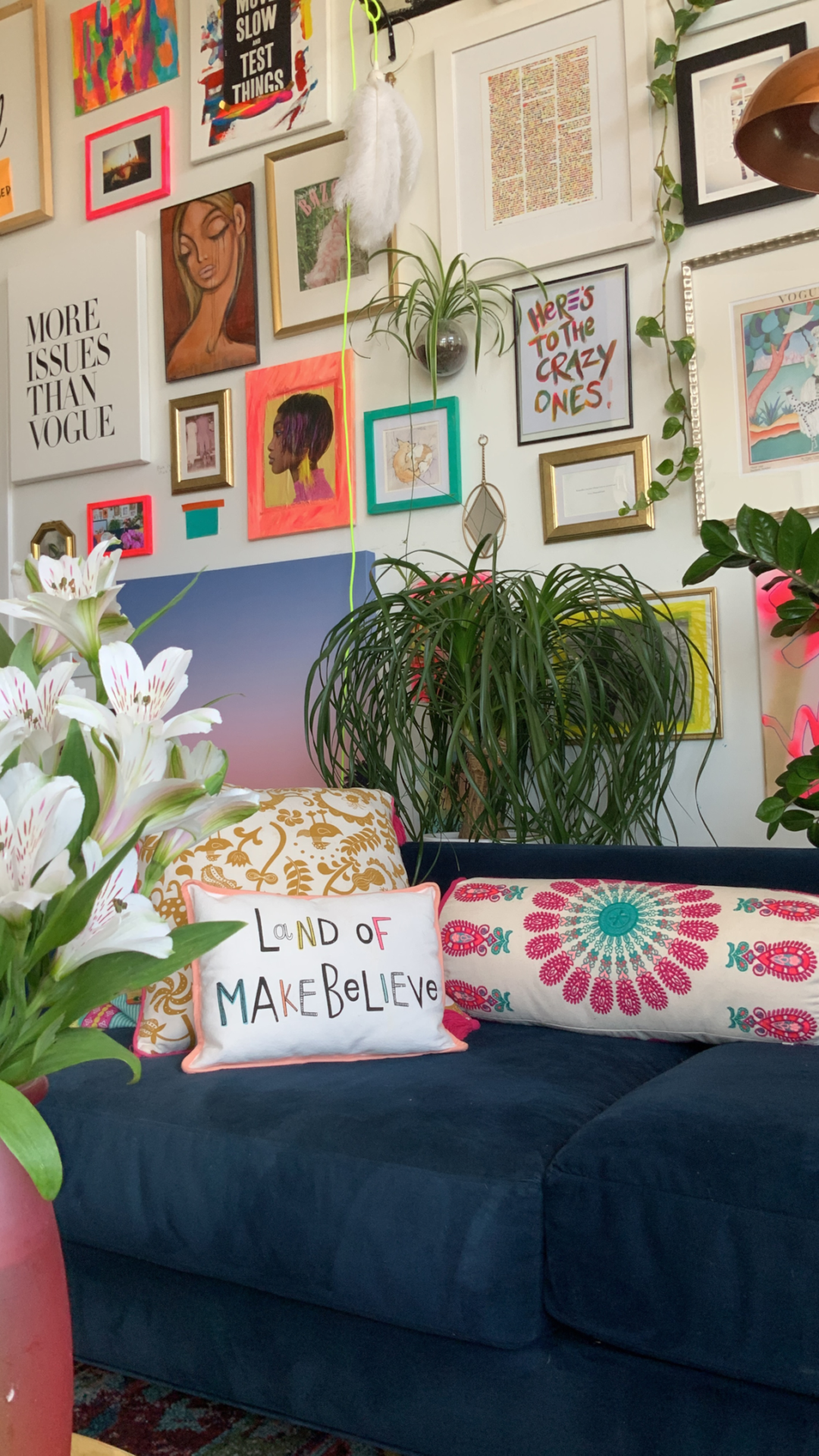 Eclectic and vibrant wall art in a Boho living room