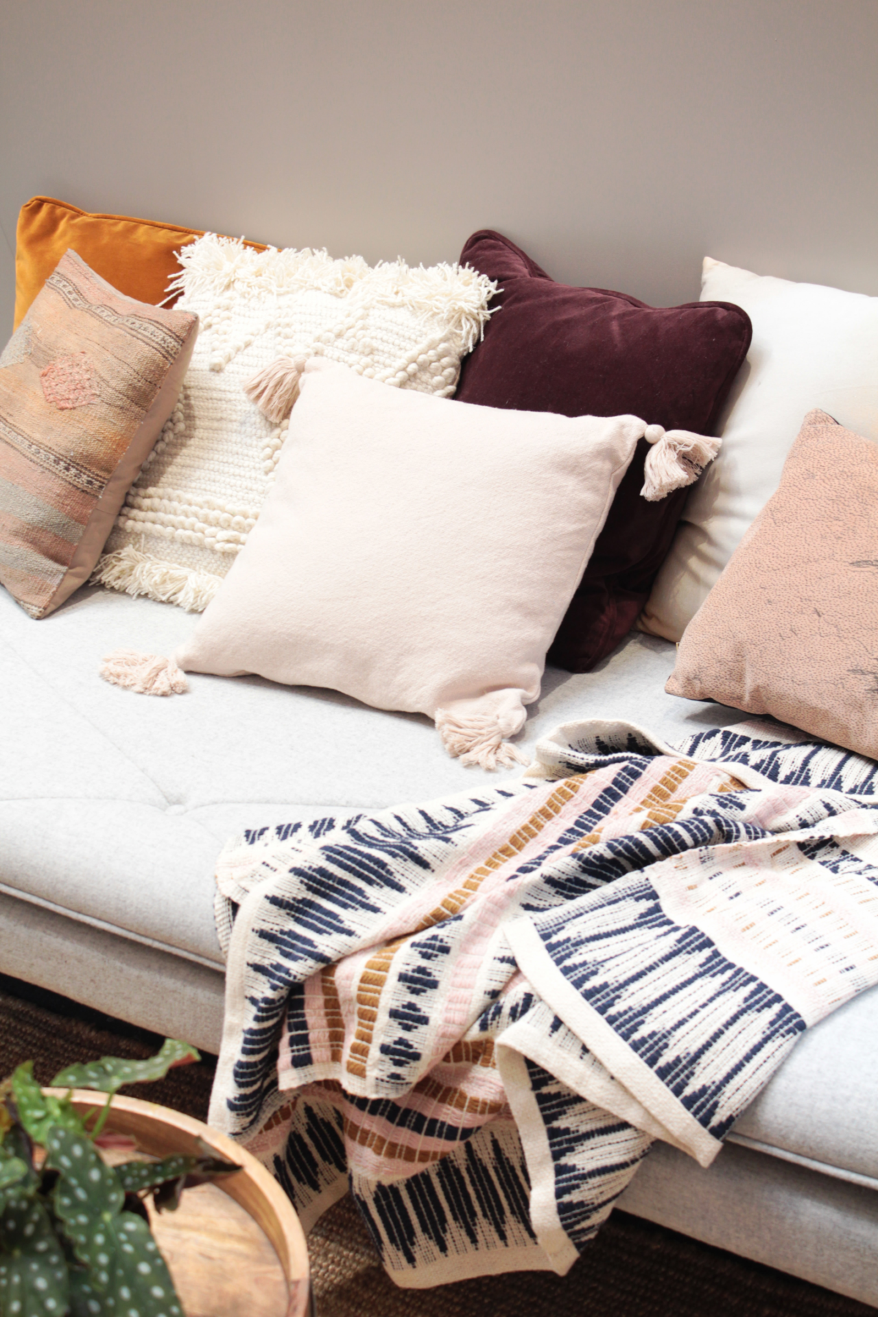 Variety of layered pillows in different textures for Boho couch