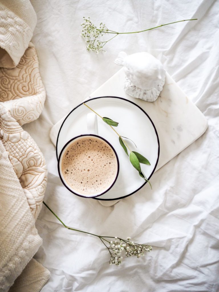 Neutral colored linens and coffee