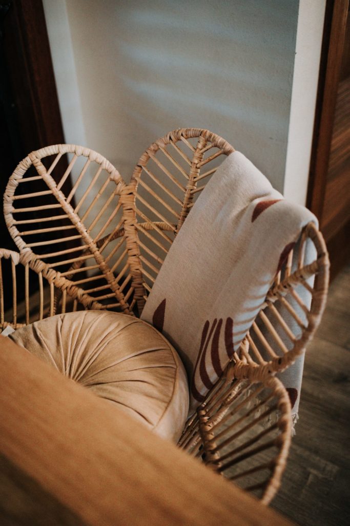 Rattan petal chair and throw